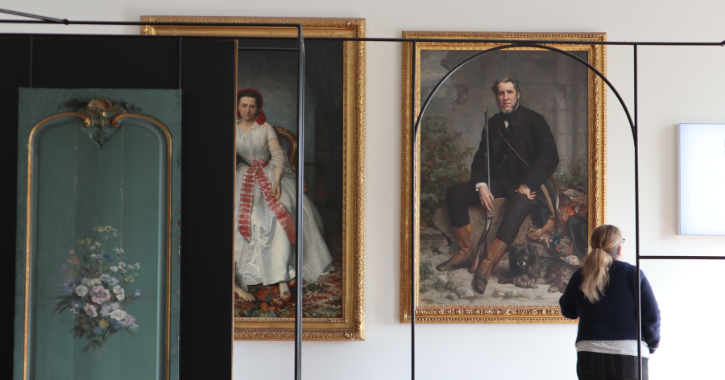 Woman stood admiring the painting portraits of The Bowes Museum founders Joséphine and John Bowes.